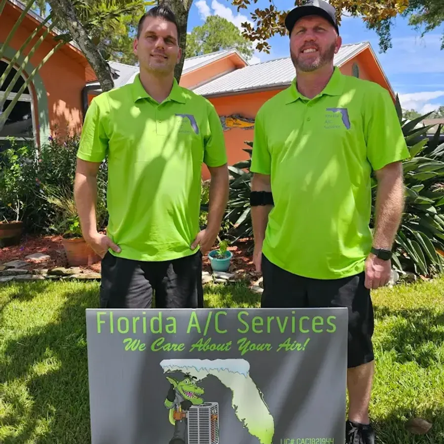 Florida A/C technician beside a fully stocked service van in Ocala, FL
